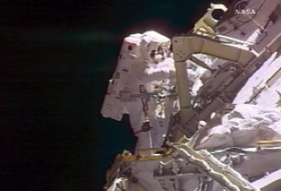 Two U.S. astronauts stepped outside the international space station to carry out a series of maintenance tasks at the orbiting outpost, their third venture out in nine days.