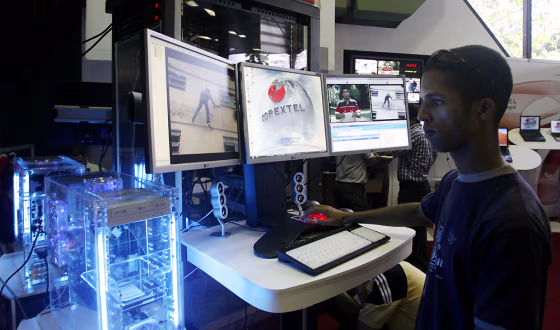A man surfs the Internet at the International Conference on Communication and Technologies in Havana. Communications Minister Ramiro Valdes has defended the country's Internet restrictions as a response to U.S. aggression and called for controlling "the wild colt of new technologies."