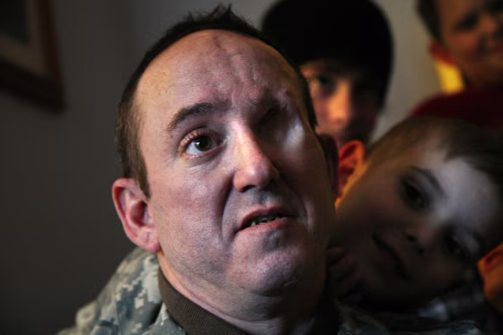 Army SSG. John Daniel Shannon with his 6-year-old son Drake Shannon, at right.&nbsp;Shannon was a sniper for Ghost Recon Platoon/2nd Infantry Div. in Iraq when he was injured. He lost his shooting eye and has been treated at Walter Reed.