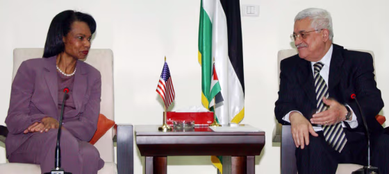 Palestinian President Mahmoud Abbas talks to Secretary of State Condoleezza Rice during their meeting in the West Bank city of Ramallah on&nbsp;Sunday.