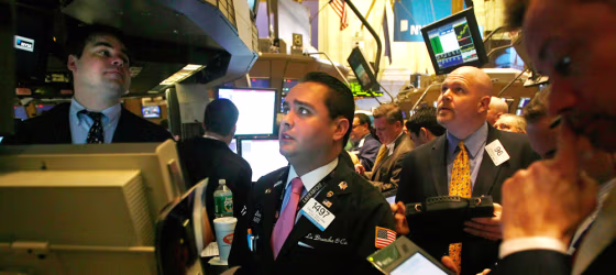 Traders work on the floor of the New York Stock Exchange