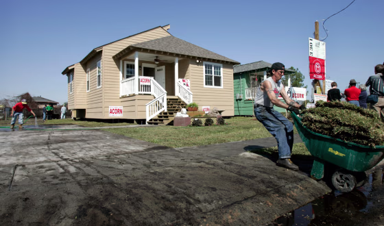 Workers put the finishing touches on what is believed to be two of the first new homes built in the Lower Ninth Ward since Hurricane Katrina hit&nbsp;New Orleans on Thursday.