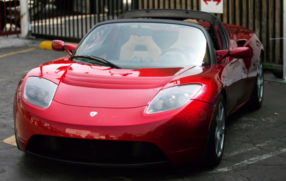 The prototype Tesla Roadster is displayed at a media event touting green transportation in Hollywood