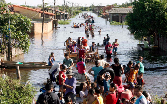 Bolivians rescue their belongings in the flooded quarter of Pantanal northeast of La Paz