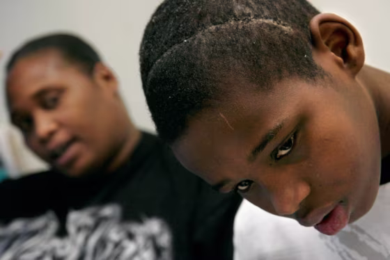 Deamonte Driver, aged 12, is shown with his mother, Alyce, at Children's Hospital in Washington, D.C., after emergency brain surgery.