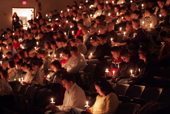 Community members gather for a candlelight vigil on the campus of Bluffton University in Bluffton, Ohio, on Friday. A bus crash near Atlanta claimed the lives of at least four members of the school's baseball team, in addition to the bus driver and his wife.