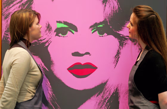 Christies auction house employees admire