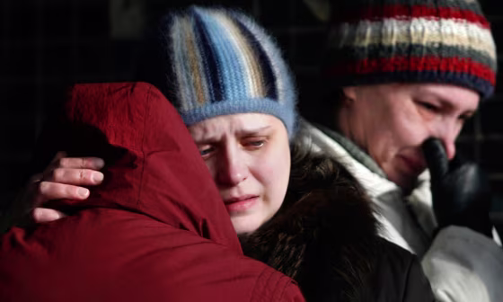 Relatives of the dead miners killed in a methane gas explosion at the Ulyanovskaya mine cry on Tuesday at a morgue in Novokuznetsk, east of Moscow. 