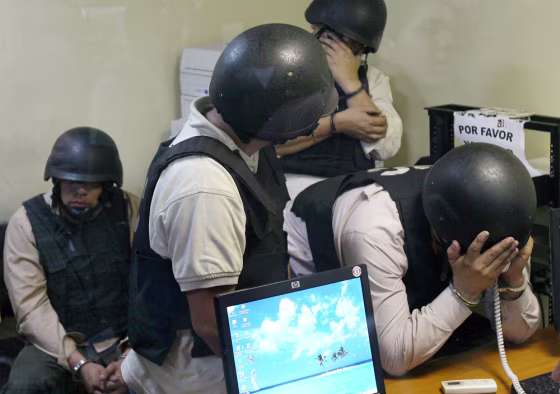 Four members of the Guatemala Police Investigation Unit, accused of the murder of three Salvadorian representatives from the Central American Parliament, register at a court in Guatemala City, on Feb. 22. The bodies of the three congressmen were found Feb. 20 on the side of a rural road in Guatemala.