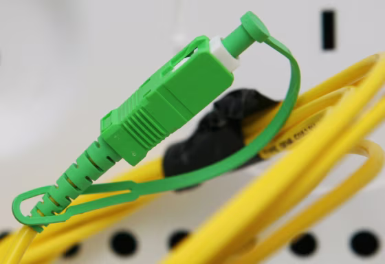 A green connector on a Verizon fiber optic cable is ready for an apartment renter to plug into for phone, cable and internet service at the 67 Wall Street luxury apartment building&nbsp;in New York. 