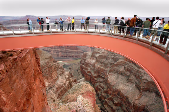 People walk on the Skywalk during the First Walk event at the Grand Canyon on the Hualapai Indian Reservation earlier this month at Grand Canyon West, Ariz.