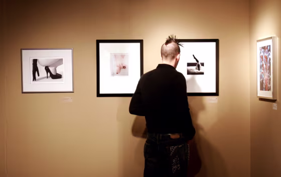 At the Seattle Erotic Art Festival in mid-March, Josh Robertson studies the photograph "Stockings" by artist Nick Chapman.