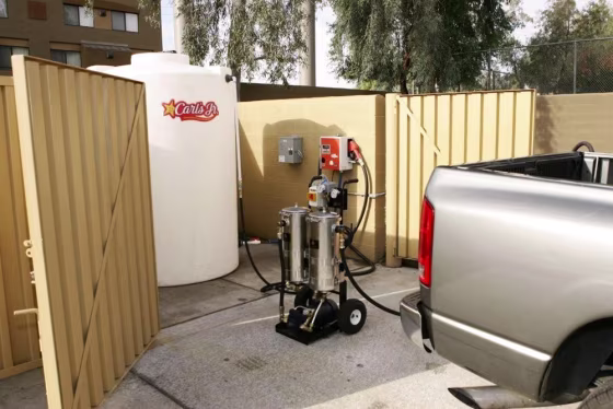 A pickup truck is refueled with a mix that includes used&nbsp;vegetable oil. The system is being used by&nbsp;a company that owns 52 Carl's Jr. franchises in Arizona.