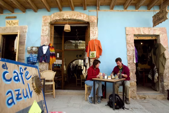 Tourists eat breakfast at a coffee shop in the old mining town of Real de Catorce, Mexico. “Police involvement in criminal activity is both legendary and true in Mexico,” the State Dept. warned.
