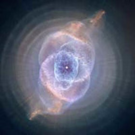 The planetary haze is created by a star like the sun, which has ejected most of its mass into space. The ejection happens when the light from the star is blocked by opaque carbon. In the middle of the planetary haze the star's core looks like it has become a so-called white dwarf.