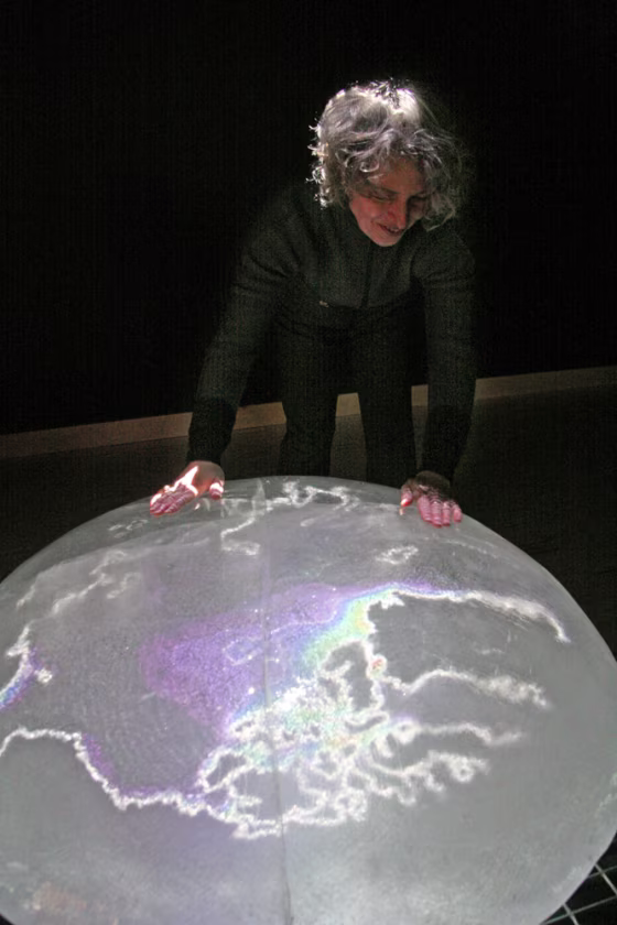 The House of Sweden opens s&nbsp;show called "Water and Environment" with ice flown in from Sweden. Here, artist Lillian Ball smooths the surface of her ice sculpture called "66 degrees by 32 North by 50 years."