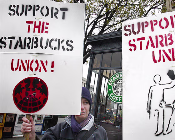 Lisa Johnson pickets outside a Starbucks in Washington D.C.'s Dupont Circle Wednesday.