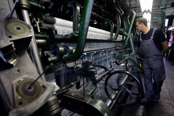 An employee of Noyon's lace company works in the plant in Calais in northern France. 
