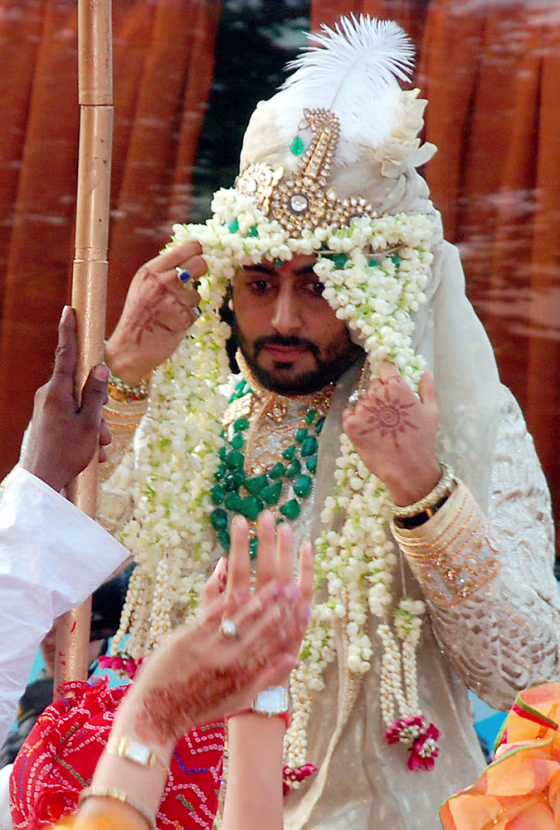 Bollywood star Bachchan rides a horse as he arrives for his wedding in Mumbai