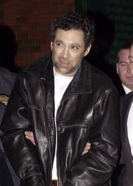 Peter Braunstein is led into a New York City Police precinct on Dec. 19, 2005.