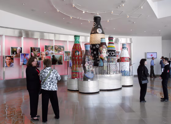 Guests check the entrance lobby area of the new World of Coca-Cola Museum in Atlanta.