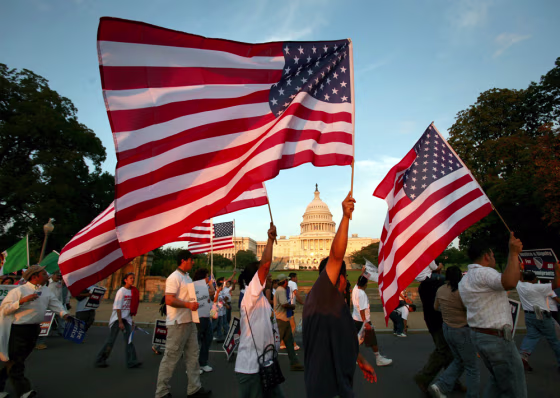 Protesters for immigrant rights march past the Capitol Building in Washington