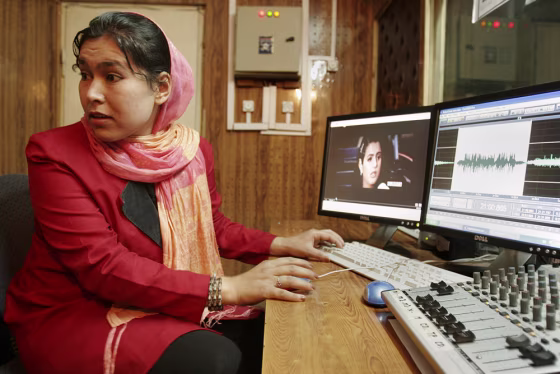Sahar Amdard, 23, records a program at the Voice of Afghan Women Radio studio in Kabul, Afghanistan, on Monday. The lives of&nbsp;Afghan women and girls have improved vastly since the fall in 2001 of the Taliban. But this month has seen a rising number of attempts to quash these advances with threats and violence.