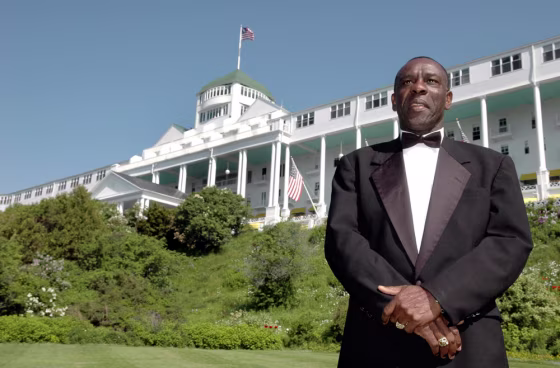 Kenneth Salmon, 52, stands near the Grand Hotel on Mackinac Island in northern Michigan, where over 36 years he has worked his way from the position of busboy to vice president of hospitality. Salmon lives in Montego Bay, Jamaica and returns each summer to oversee the operations of the exclusive hotel.