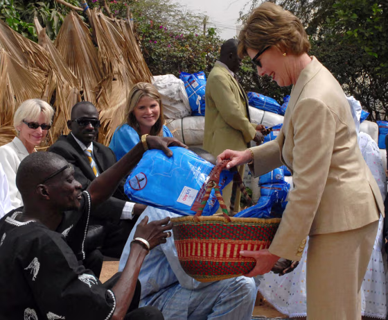 U.S. first lady Laura Bush distributes mosquito nets at the Fann hospital in Dakar