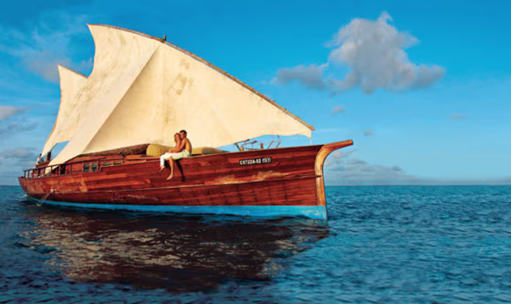 Take to the seas in your own luxurious wooden yacht, which comes with every bungalow at Don Mighili in the Maldives.