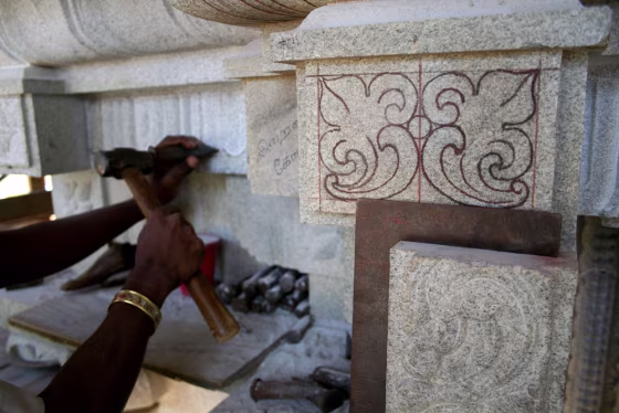 An Indian artisan completes detailed carving on a stone temple to the Hindu god Shiva on the Hawaiian island of Kauai on May 21.