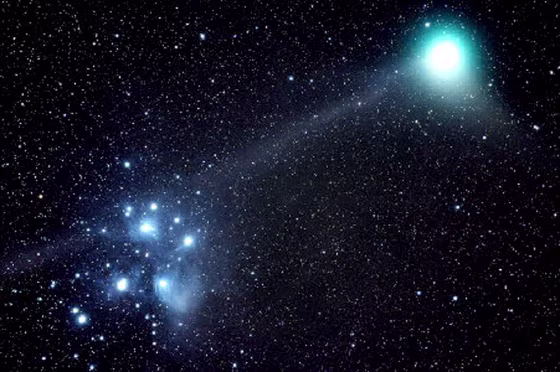 Isolated locales with dark skies make for ideal stargazing opportunities, like this one of Comet Macholz going through Pleiades. 
