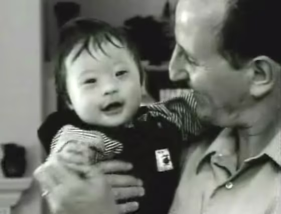 Mark Warschauer, a father whose 10-month-old son Mikey died after being left in a hot car, is seen with his child in an undated video still image from the public service announcement in which he appears.