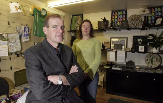 Sinn Fein Councillor Terry Hearty and Maria Caraher pose for the camera in the Sinn Fein office in the village of Crossmaglen in Northern Ireland