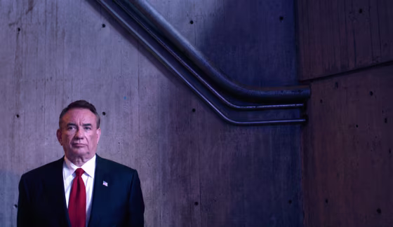Republican Presidential Candidate Tommy Thompson waits to be introduced during the Iowa Straw Poll in Ames