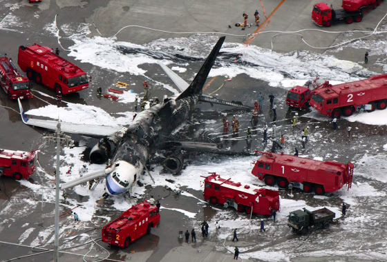 The charred remains of a China Airlines plane lies on the tarmac on Japan's southern island of Okinawa