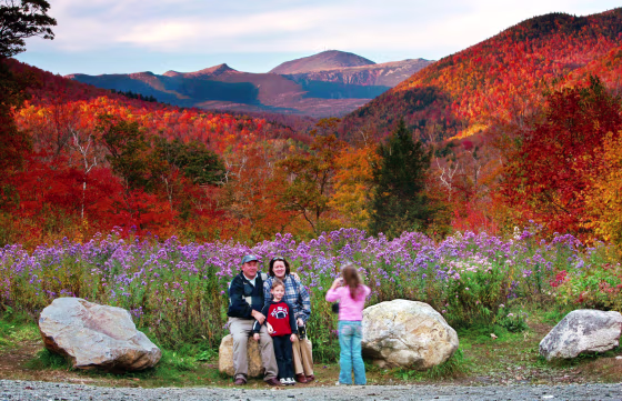 Wildflowers, fall foliage and 6,288-foot Mt. Washington serve as a backdrop for Jim and Kathleen Gannon and their son James as their daughter Katarina snaps a picture at Crawford Notch State Park in New Hampshire last fall.