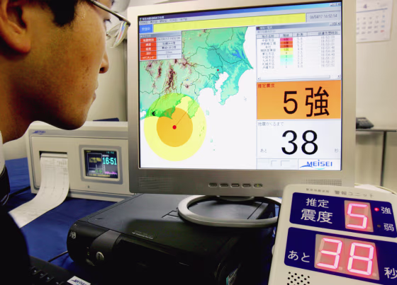 Akihiko Sawamura, a field engineer of Meisei Electric Co. in Yokohama, looks at a monitor screen indicating that a strong level 5 earthquake will hit Tokyo in 38 seconds, during&nbsp;a simulated demonstration of his company's earthquake information system.