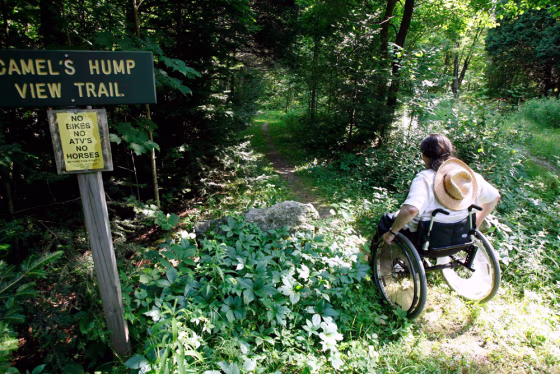 Deborah Lisi-Baker starts her wheelchair up the View Trail at Camel's Hump in Duxbury, Vt. The Camel's Hump View Trail is part of a nationwide push in the past 20 years to make more of the great outdoors accessible to people with disabilities.