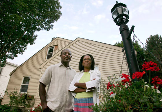 Milca and Josy Fanfan thought they had a fixed-rate mortgage. At closing they were told the loan would be adjustable-rate. Monthly payments on the adjustable-rate mortgage have ballooned from $1,700 to $3,000. They are struggling to keep their home.