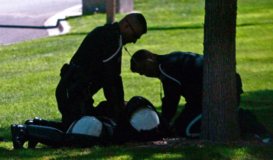 Medics try to save Germaine Casey, 40, after his motorcycle accident in Albuquerque.