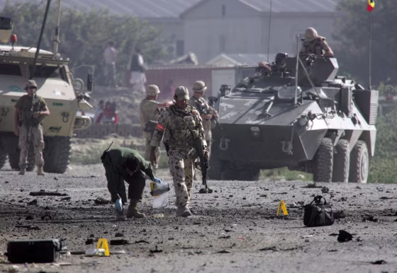Investigators examine the scene of a&nbsp;suicide attack in Kabul, Afghanistan, on&nbsp;Friday.