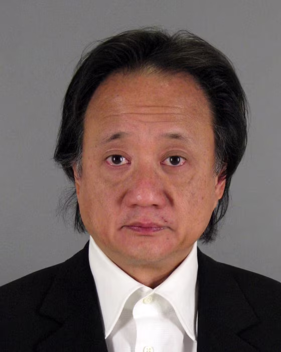 Booking photo of fundraiser Norman Hsu