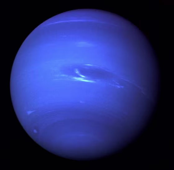 This picture of Neptune was taken by Voyager 2 and shows the Great Dark Spot, an Earth-size storm system.