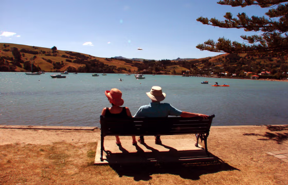 Vacationers enjoy the sunshine in the French-accented town of Akaroa, on the Banks Peninsula near Christchurch in New Zealand's South Island.