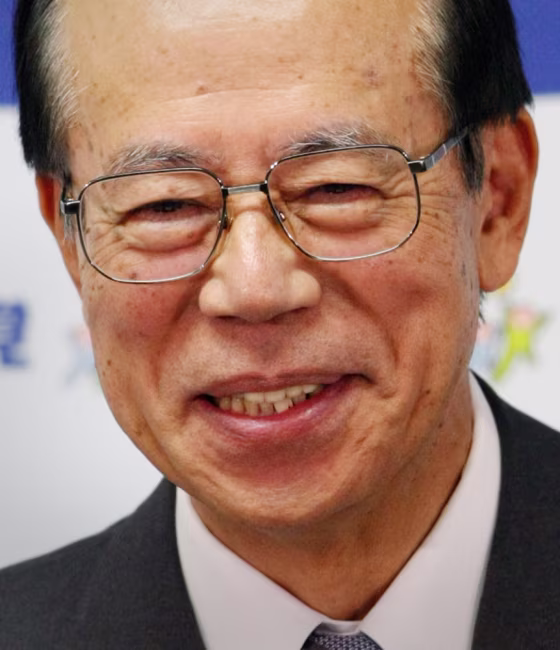 Former chief cabinet secretary Yasuo Fukuda smiles as he speaks at his first news conference after being elected president of the Liberal Democratic Party in Tokyo