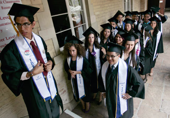 Undocumented UCLA students stand in line at a graduation ceremony for UCLA "Dreamers", or Dream Act students, at a church near the campus in Los Angeles.