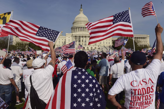 Image: People show their support during a rally for comprehensive immigration reform on the West Front of the US Capitol