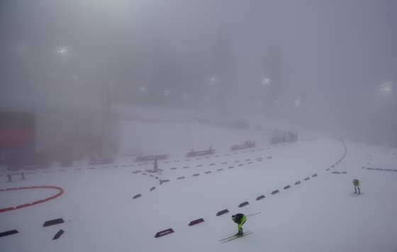 Image: Athletes ski through the fog as the men's biathlon 15K mass start race was postponed due to the lack of visibility at the 2014 Winter Olympics, Sunday, Feb. 16, 2014, in Krasnaya Polyana, Russia
