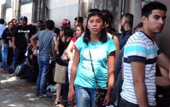 Young people wait in line to enter the offices of the Coalition for Humane Immigrant Rights of Los Angeles (CHIRLA) on August 15, 2012 in Los Angeles, California, on the first day of the Deferred Action for Childhood Arrivals (DACA) program.
